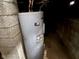 Unfinished basement with water heater at 2317 Fowler St, Anderson, IN 46012