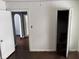 Empty bedroom features hardwood floors and access to other rooms at 2317 Fowler St, Anderson, IN 46012