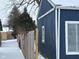 Blue detached garage with white trim, winter scene at 2317 Fowler St, Anderson, IN 46012