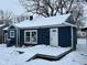 Blue house with white trim, snow covered deck at 2317 Fowler St, Anderson, IN 46012