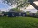 A shot showcasing the rear exterior, with ample backyard space and a view of the surrounding neighborhood at 2317 Fowler St, Anderson, IN 46012