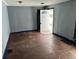 Living room with hardwood floors, needs updating at 2317 Fowler St, Anderson, IN 46012
