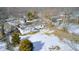 Aerial view of a house with a backyard, shed, and snow on the ground at 233 S Routiers Ave, Indianapolis, IN 46219