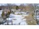 Aerial view of house with backyard and snowy landscape at 233 S Routiers Ave, Indianapolis, IN 46219