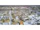 Aerial view of a neighborhood with houses and snow-covered yards at 233 S Routiers Ave, Indianapolis, IN 46219