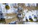 Aerial view of a house with a snow-covered yard and shed at 233 S Routiers Ave, Indianapolis, IN 46219
