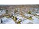 Aerial view of a house with a backyard, shed, and snow on the ground at 233 S Routiers Ave, Indianapolis, IN 46219