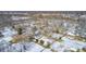 Aerial view of a neighborhood with houses covered in snow at 233 S Routiers Ave, Indianapolis, IN 46219
