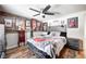 Music themed bedroom, wood bed frame, and rock and roll decor at 233 S Routiers Ave, Indianapolis, IN 46219