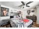 Music-themed bedroom with guitar bedding and rock memorabilia at 233 S Routiers Ave, Indianapolis, IN 46219