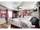 Music-themed bedroom with guitar bedding and rock memorabilia at 233 S Routiers Ave, Indianapolis, IN 46219