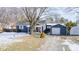 Charming one-story home with a covered porch, detached garage, and shed at 233 S Routiers Ave, Indianapolis, IN 46219