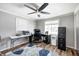 Bright home office features built-in shelving and hardwood floors at 233 S Routiers Ave, Indianapolis, IN 46219