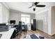 Home office with hardwood floors, desk, and ample storage at 233 S Routiers Ave, Indianapolis, IN 46219