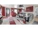 Cozy living room featuring a gray sofa, area rug, and a ceiling fan at 233 S Routiers Ave, Indianapolis, IN 46219