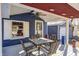 Cozy covered porch with a table and chairs, perfect for relaxing at 233 S Routiers Ave, Indianapolis, IN 46219