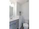 Clean bathroom with gray vanity and white toilet at 2406 Ninebark Dr, Plainfield, IN 46168