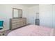 Well-lit bedroom featuring a dresser and built-in closet at 2406 Ninebark Dr, Plainfield, IN 46168