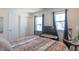 Spacious bedroom with a large bed, comfortable chair, and plenty of natural light at 2406 Ninebark Dr, Plainfield, IN 46168