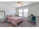 Bright bedroom with pink bedding and built-in workspace at 2406 Ninebark Dr, Plainfield, IN 46168