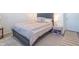 Cozy bedroom with a bed, nightstand and a chair at 2406 Ninebark Dr, Plainfield, IN 46168