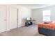 Cozy bedroom with a comfortable couch and flat-screen TV at 2406 Ninebark Dr, Plainfield, IN 46168