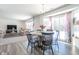 Casual dining area with round table and chairs, open to living room at 2406 Ninebark Dr, Plainfield, IN 46168