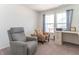Relaxing home office features two armchairs and a large window at 2406 Ninebark Dr, Plainfield, IN 46168