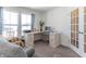 Home office with corner desk, comfortable chairs, and plenty of natural light at 2406 Ninebark Dr, Plainfield, IN 46168