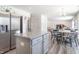Open concept kitchen with stainless steel refrigerator and island at 2406 Ninebark Dr, Plainfield, IN 46168