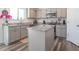 Modern kitchen featuring gray cabinets and granite island at 2406 Ninebark Dr, Plainfield, IN 46168