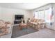 Spacious living room featuring floral sofas and large windows at 2406 Ninebark Dr, Plainfield, IN 46168
