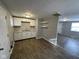 Efficient kitchen with white cabinets and dark wood-look floors at 2442 Asbury St, Indianapolis, IN 46203