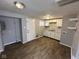 White kitchen cabinets, wood-look floors, and laundry hookups at 2442 Asbury St, Indianapolis, IN 46203