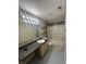 Bathroom with checkered floors and a tub at 2507 Redland Ln, Indianapolis, IN 46217