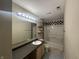 Bathroom with a black and white checkered backsplash and a bathtub at 2507 Redland Ln, Indianapolis, IN 46217