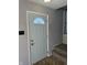 Interior entryway with a white door and carpeted stairs at 2507 Redland Ln, Indianapolis, IN 46217
