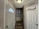 Inviting entryway with stairs and coat rack at 2507 Redland Ln, Indianapolis, IN 46217