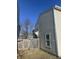 Tan vinyl sided home with a wooden fence at 2507 Redland Ln, Indianapolis, IN 46217