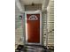 Red front door with a window and welcome mat at 2507 Redland Ln, Indianapolis, IN 46217