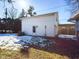 White detached garage with side door and snow on the ground at 2509 W Euclid Ave, Muncie, IN 47304