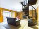 Gathering room features a spiral staircase, fireplace, and built-in shelving at 2509 W Euclid Ave, Muncie, IN 47304