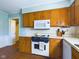 Kitchen with wood cabinets and a tile floor at 2509 W Euclid Ave, Muncie, IN 47304