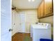 Laundry room with washer, dryer, and storage cabinets at 2509 W Euclid Ave, Muncie, IN 47304