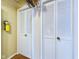 Storage room with built-in shelving and louvered doors at 2509 W Euclid Ave, Muncie, IN 47304