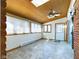 Bright sunroom with skylights, tile floors, and sliding glass doors at 2509 W Euclid Ave, Muncie, IN 47304
