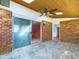Sunroom with brick walls, skylights, and access to other rooms at 2509 W Euclid Ave, Muncie, IN 47304