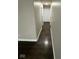 Hallway with dark hardwood floors and neutral walls at 2711 E 28Th St, Indianapolis, IN 46218