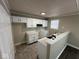 Kitchen with white cabinets and granite countertops at 2711 E 28Th St, Indianapolis, IN 46218