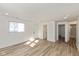 Bright living room with laminate floors and access to bathroom and bedroom at 3035 Alice Ave, Indianapolis, IN 46237